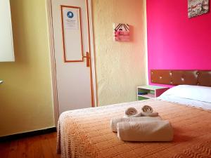 Posteľ alebo postele v izbe v ubytovaní Hostal Padre Isla 1
