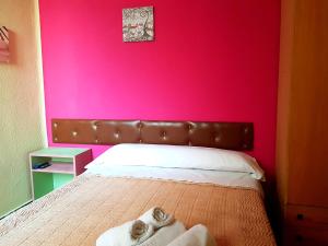 Posteľ alebo postele v izbe v ubytovaní Hostal Padre Isla 1