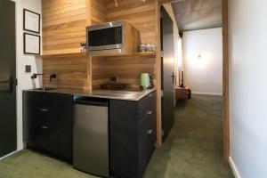 A kitchen or kitchenette at The Cinema Suites