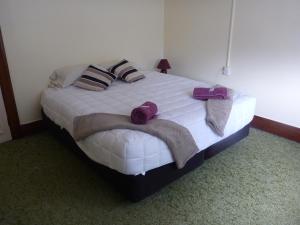 A bed or beds in a room at Beaumont Hotel and Holiday Park