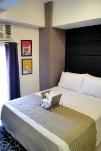 Postel nebo postele na pokoji v ubytování Saint Croix at Tagaytay Prime Residences + 13 fotografií