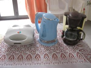 a table with a tea pot and a blender at Amaryllis Hotel in Karpathos