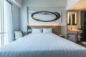 Giường trong phòng chung tại Enso Hotel
