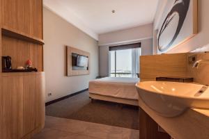 Giường trong phòng chung tại Enso Hotel