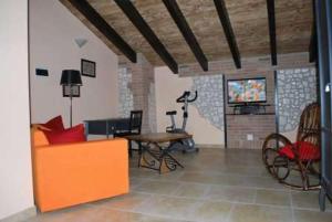 a living room with a couch and a table at Sosta Fiera B&B in Rho