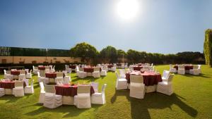 a group of tables and chairs in a field at Hotel Royal Orchid Jaipur, Tonk Road in Jaipur