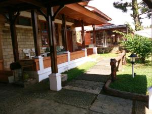 a house with a fire hydrant in front of it at Vila Kota Bunga Private Pool in Puncak