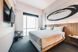 Giường trong phòng chung tại Enso Hotel