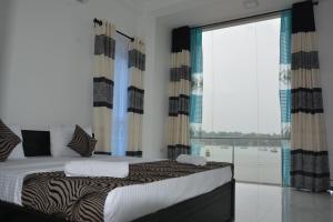 Katil atau katil-katil dalam bilik di Trinco Lagoon
