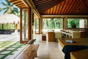 a room with a kitchen and a living room at Kumara Luxury Villa in Weligama