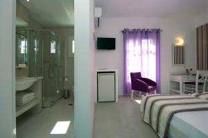 Postel nebo postele na pokoji v ubytování Kalypso Hotel