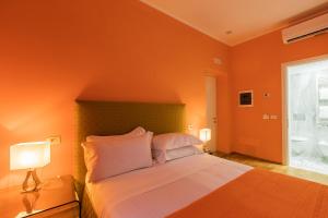 Postel nebo postele na pokoji v ubytování Hotel la Scala