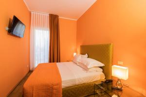 Postel nebo postele na pokoji v ubytování Hotel la Scala