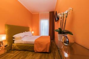 Postel nebo postele na pokoji v ubytování Hotel la Scala