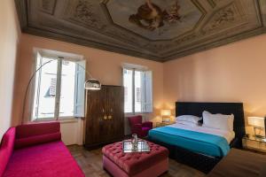 A bed or beds in a room at Hotel la Scala