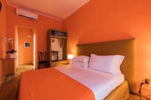 Postel nebo postele na pokoji v ubytování Hotel la Scala