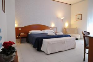 Postel nebo postele na pokoji v ubytování Villa Dei Principi Hotel