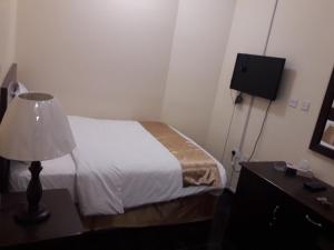 Letto o letti in una camera di Lake Hotel