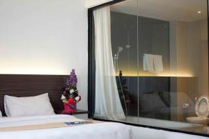 Voodi või voodid majutusasutuse Yunna Hotel Lampung toas