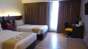 Voodi või voodid majutusasutuse Yunna Hotel Lampung toas