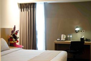 Voodi või voodid majutusasutuse Yunna Hotel Lampung toas