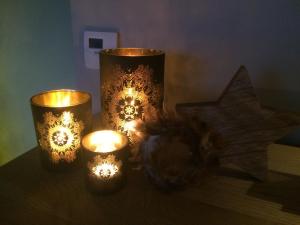 a table with candles and a star on it at Maison Louise in Middelkerke