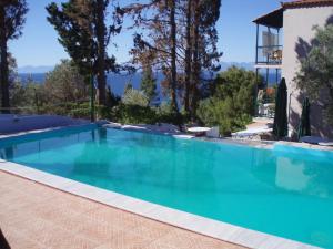 a large swimming pool with blue water at Pelagos in Stafylos