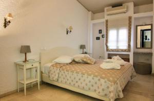 Кровать или кровати в номере Mare Vista Hotel - Epaminondas