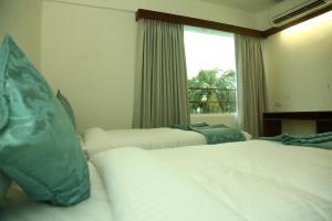 Postel nebo postele na pokoji v ubytování Niko Hotels