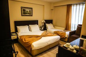 Postelja oz. postelje v sobi nastanitve Canakkale Bogaz Hotel