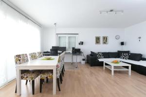 a living room with a table and a couch at Truly Mediterranean Apartment "Spark" in Korčula