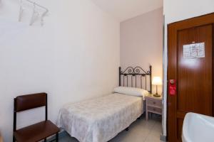 Postel nebo postele na pokoji v ubytování Pension Mesones