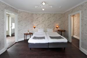 מיטה או מיטות בחדר ב-Ardrebo B&B