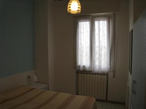 A bed or beds in a room at Appartamento Adriatico Még 4 kép