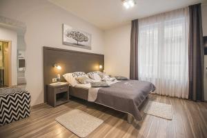 Postel nebo postele na pokoji v ubytování Holiday Center Ivona