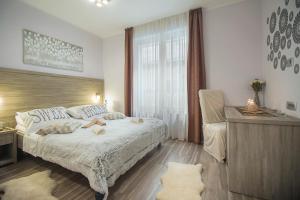 Postel nebo postele na pokoji v ubytování Holiday Center Ivona