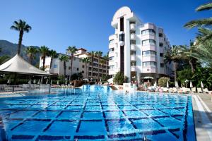 a large swimming pool in front of a hotel at Hotel Aqua in Marmaris