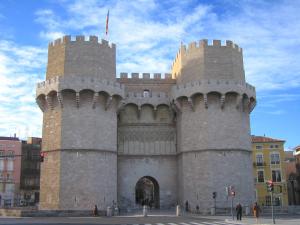 a large building with two towers on a city street at Hotel Albufera in Alfafar