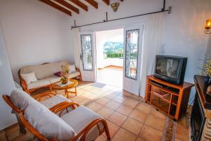 A television and/or entertainment centre at Marcelo - charming, Finca style holiday villa in Moraira