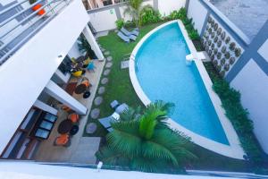 an overhead view of a swimming pool on a building at The Palms by Eagles Accra in Accra