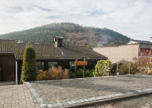 a house with a mountain in the background at Margaritenweg 31-F, Winterberg-Niedersfeld in Winterberg