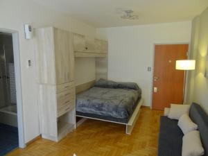 Apartamento en San telmo tesisinde bir odada yatak veya yataklar