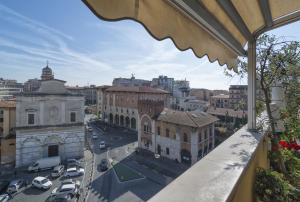 a view of a city from a balcony at B&B Dei Cavalieri in Pisa