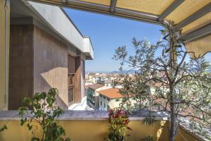 a window view of a city from a balcony at B&B Dei Cavalieri in Pisa