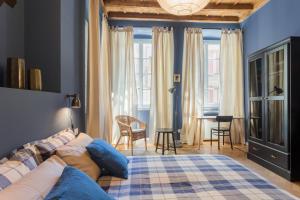 a bedroom with a bed and a table and chairs at COSY APARTMENT 2 MINUTES FROM DUOMO in Milan