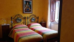 Postel nebo postele na pokoji v ubytování Borgo La Forgia