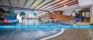 a large indoor swimming pool in a resort at Alpenhäusl in Sölden