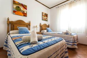 Giường trong phòng chung tại Villa Angelyn