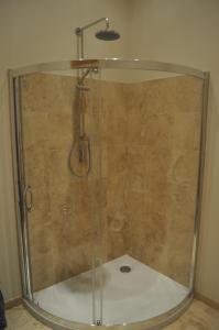a shower with a glass enclosure in a bathroom at The Old Stables, Alltshellach Cottages in North Ballachulish +16 photos