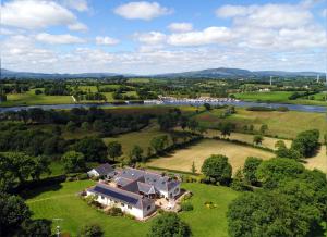an aerial view of a large house on a green field at Willowbank House in Enniskillen